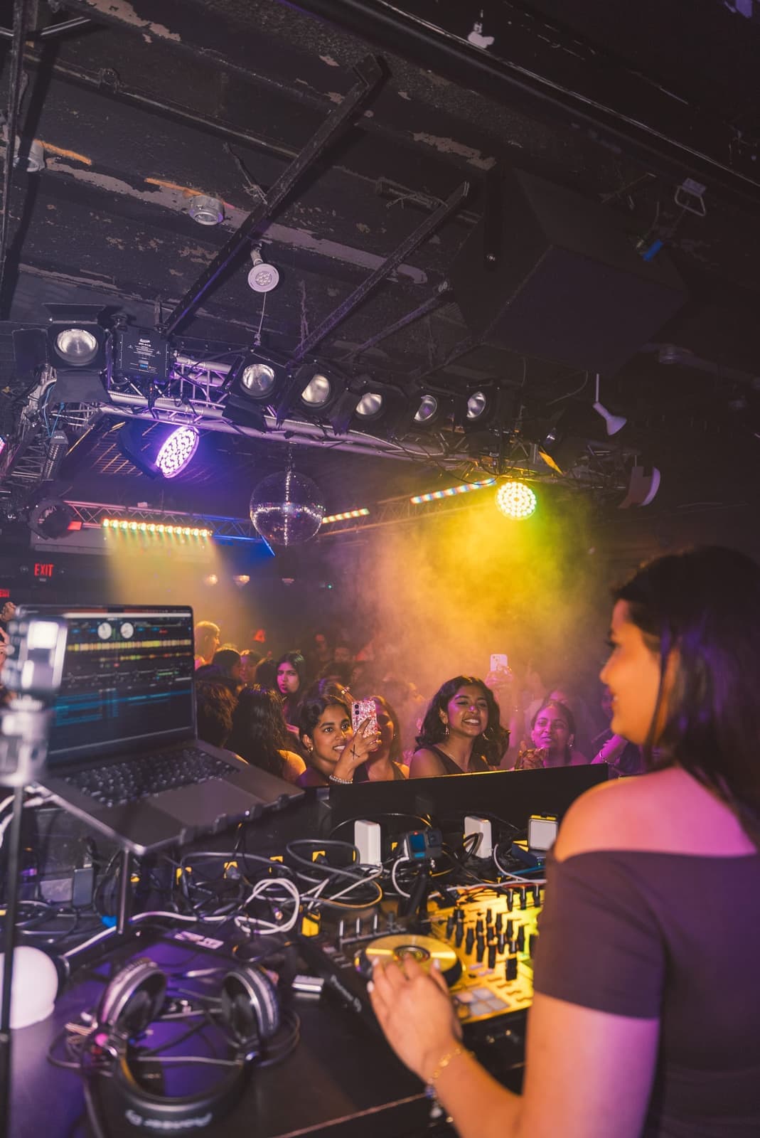 The campus crowd seen from behind the DJ booth