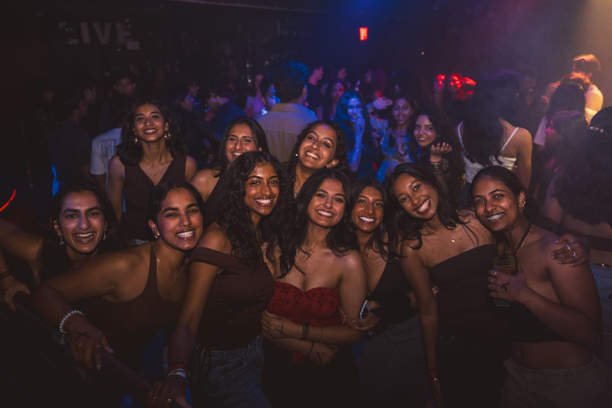 Friends smiling together during a campus night